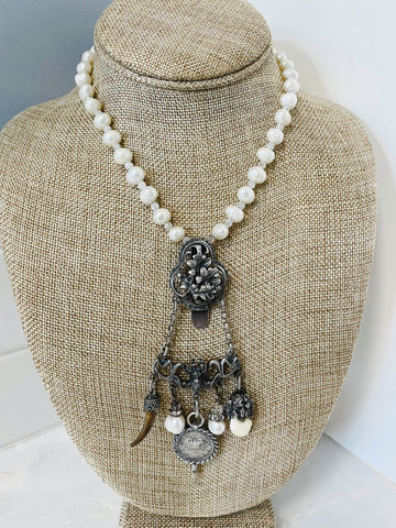 vintage chatelaine hangs from a freshwater pearl and moonstone gemstone necklace