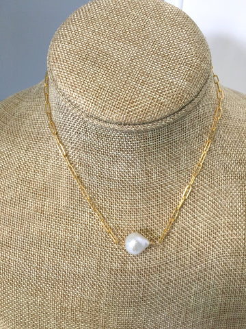 gold and white necklace