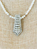 white and silver necklace