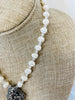 Necklace is made of white freshwater pearls and faceted moonstone gemstones