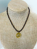 Faceted garnets and bee pendant necklace