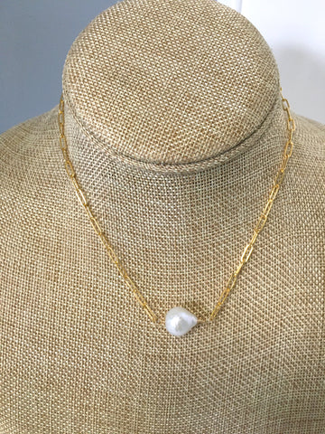 gold and white necklace 