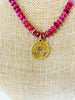 fleur-de-lis charm and red ruby necklace