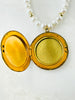 inside of the gold locket has spots for a photo on both sides