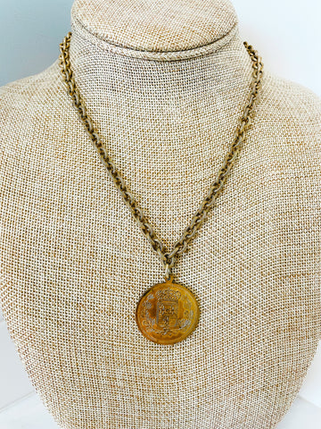 vintage gold colored chain and vintage french coin pendant
