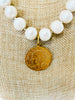 brass french coin pendant and white pearls