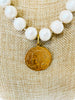 brass french coin pendant and white pearls